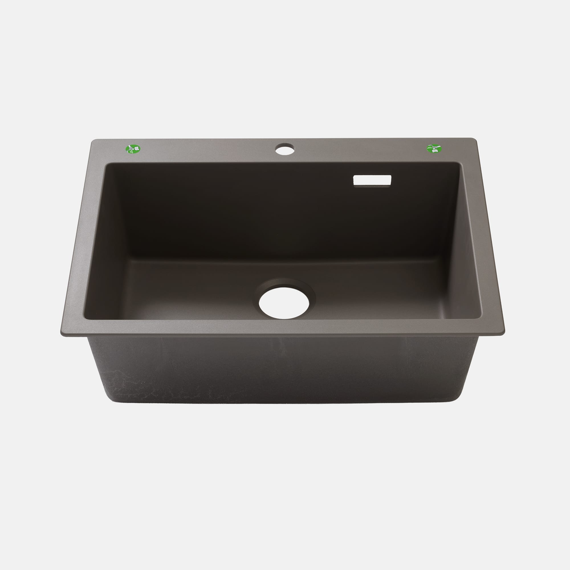 クォーツシンク シングル グレー KB-KC031-10-G173 中央に水栓穴φ35mmが空いています。左右の緑色シール2箇所に追加の水栓や、浄水器やソープディスペンサー用に穴を追加できます